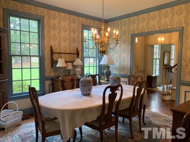 717 Brookfield Road Raleigh, NC 27615 - Photo 15 of 30 a view of a dining room with furniture window and outside view