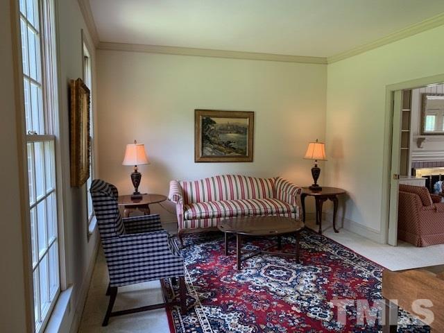 717 Brookfield Road Raleigh, NC 27615 - Photo 16 of 30 a view of a bedroom with furniture and wooden floor
