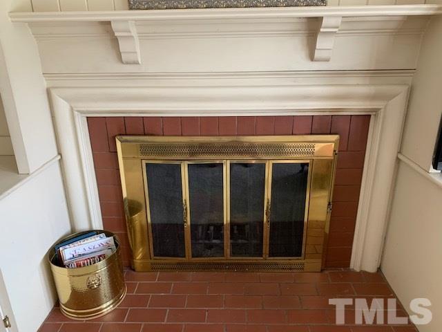 717 Brookfield Road Raleigh, NC 27615 - Photo 18 of 30 a close view of a fireplace with dryer and washer