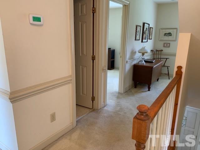 717 Brookfield Road Raleigh, NC 27615 - Photo 19 of 30 a view of a hallway with workspace and a couch