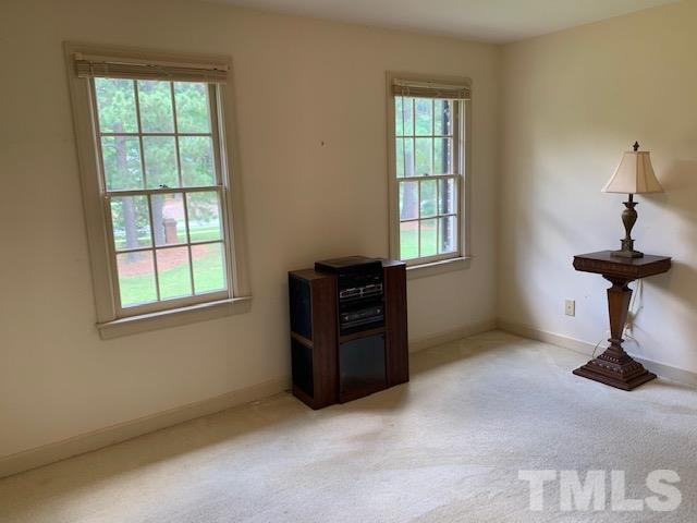 717 Brookfield Road Raleigh, NC 27615 - Photo 22 of 30 a view of an empty room with a window