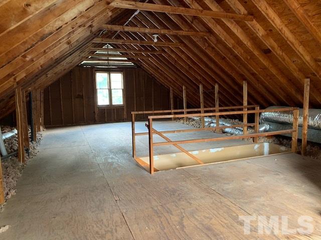 717 Brookfield Road Raleigh, NC 27615 - Photo 25 of 30 a view of an empty room with gym equipment