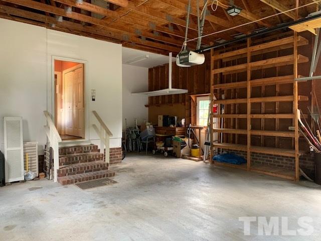 717 Brookfield Road Raleigh, NC 27615 - Photo 27 of 30 a view of an empty room with wooden floor and furniture