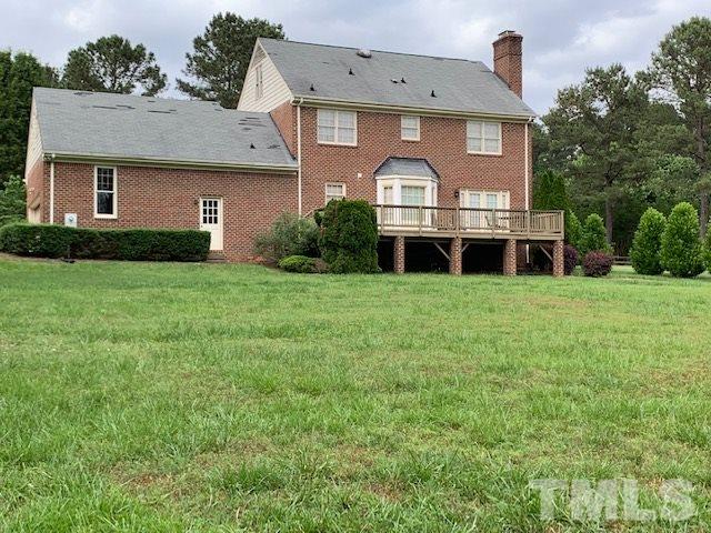 717 Brookfield Road Raleigh, NC 27615 - Photo 28 of 30 a view of a house with yard and deck