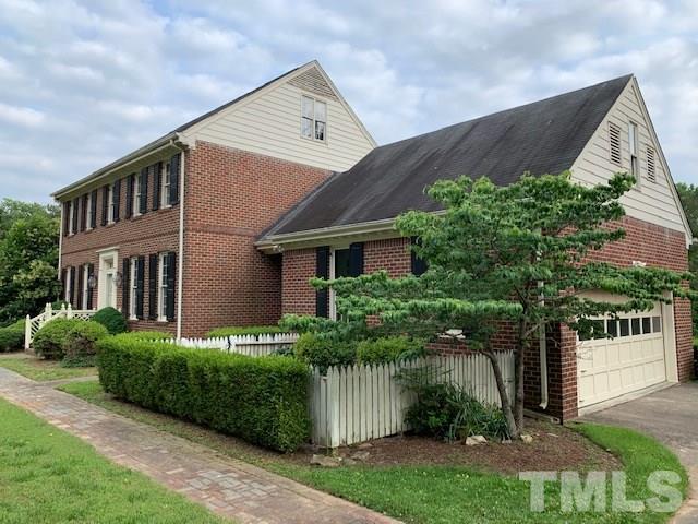 717 Brookfield Road Raleigh, NC 27615 - Photo 5 of 30 a front view of a house with a garden