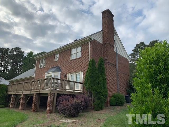 717 Brookfield Road Raleigh, NC 27615 - Photo 6 of 30 a front view of a house with a garden