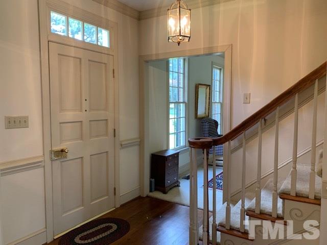 717 Brookfield Road Raleigh, NC 27615 - Photo 8 of 30 a view of entryway with wooden floor