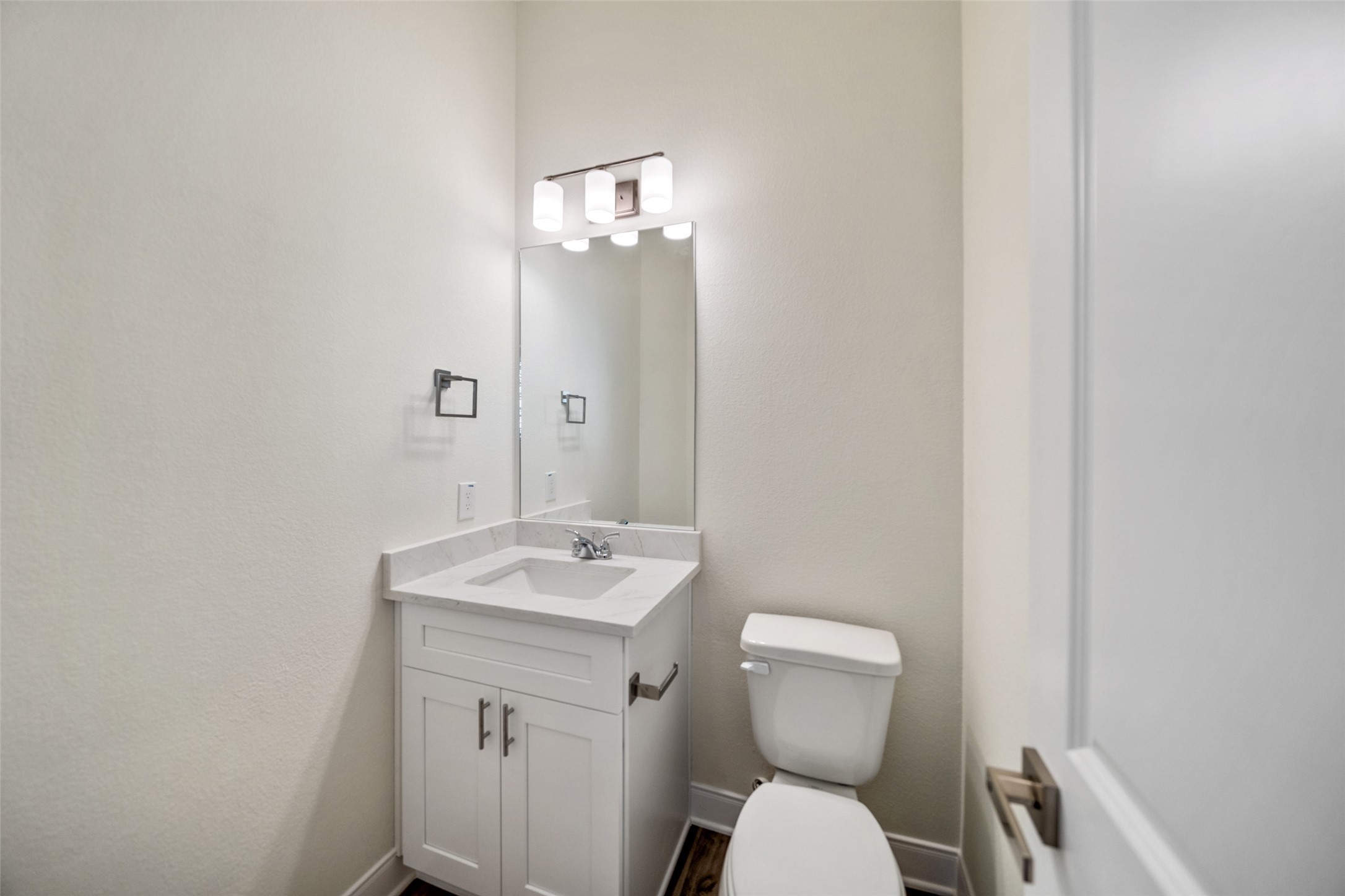 412 West Marlin Street Willis, TX 77378 - Photo 20 of 22 a bathroom with a toilet sink and mirror