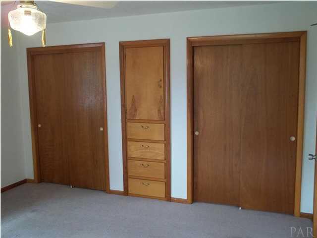 Double closets and built in storage in Master bedroom.