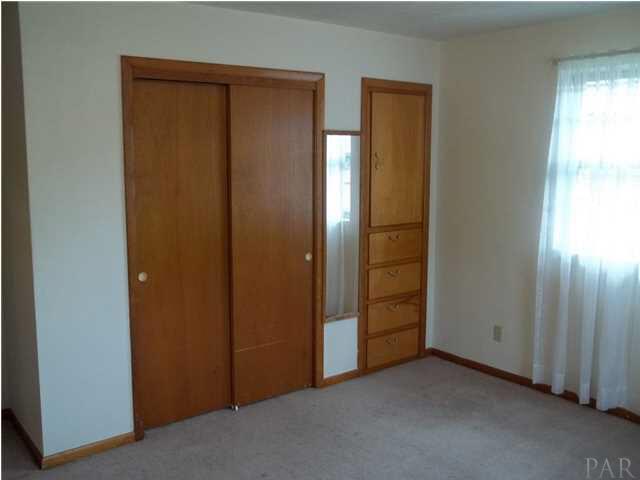 6916 Olsen Road Pensacola, FL 32506 - Photo 8 of 15 Second bedroom with built in storage.