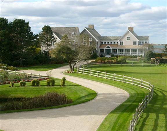 88 Mill Lane Yarmouth, MA 02675 - Photo 12 of 13 a view of a white house in a big yard with palm trees