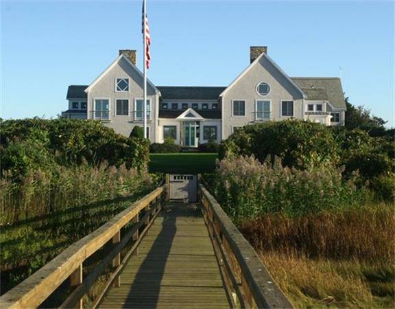 88 Mill Lane Yarmouth, MA 02675 - Photo 5 of 13 a front view of a house with a yard