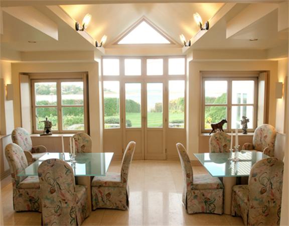 88 Mill Lane Yarmouth, MA 02675 - Photo 7 of 13 a living room with furniture and large windows