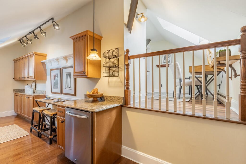 8 Summer Street, Unit 415 Gloucester, MA 01930 - Photo 11 of 32 a view of a kitchen with furniture and a kitchen