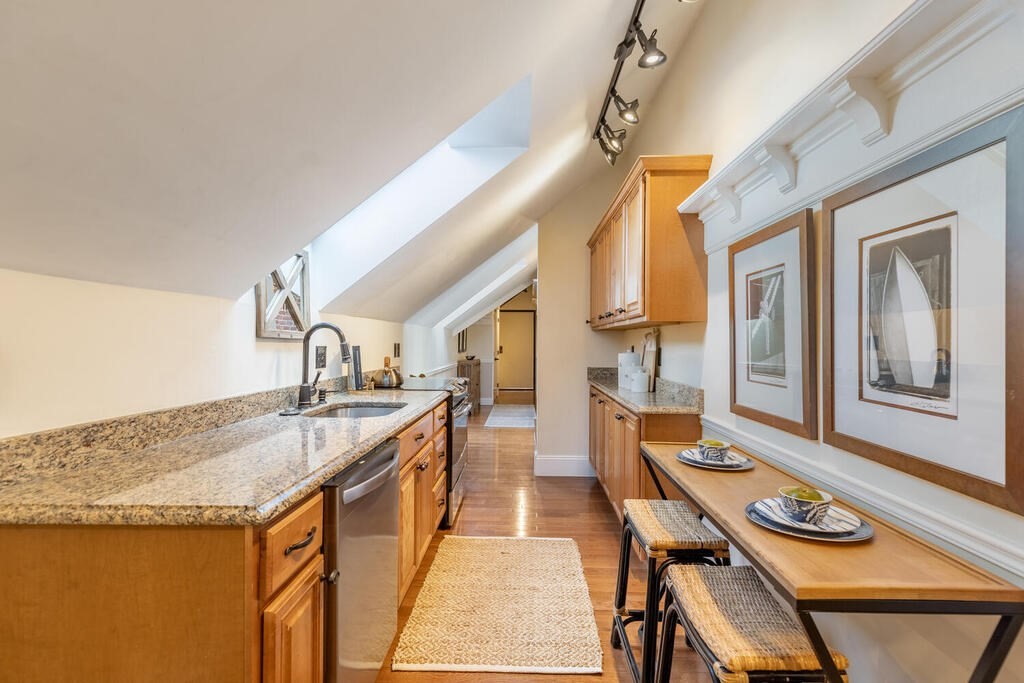 8 Summer Street, Unit 415 Gloucester, MA 01930 - Photo 13 of 32 a very nice looking kitchen with a large window