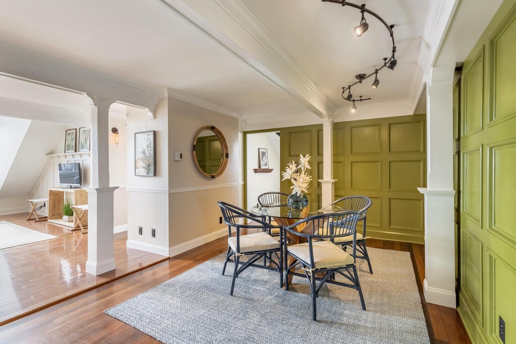 8 Summer Street, Unit 415 Gloucester, MA 01930 - Photo 14 of 32 a view of a dining room with furniture and wooden floor