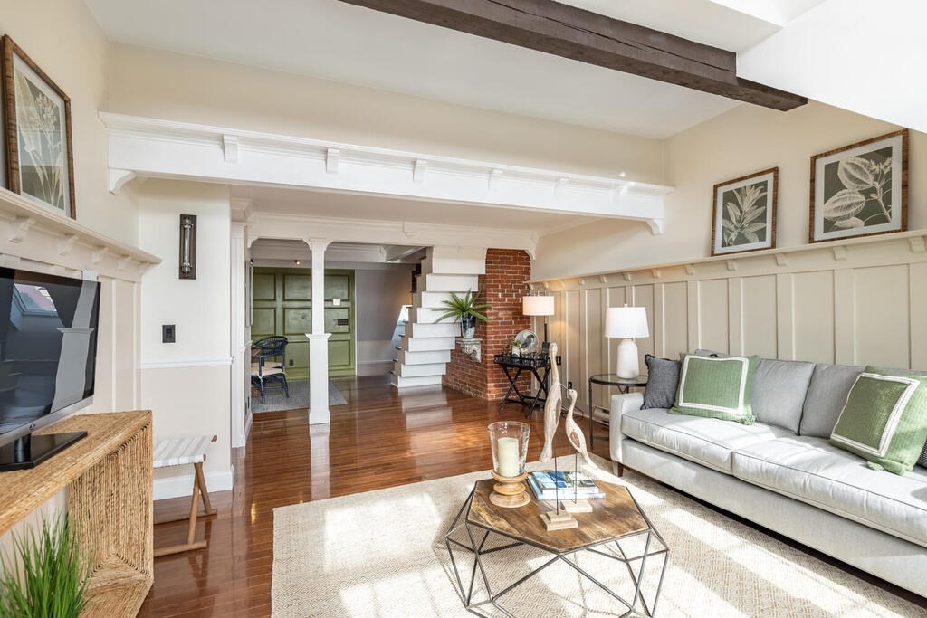 8 Summer Street, Unit 415 Gloucester, MA 01930 - Photo 20 of 32 a living room with furniture and a flat screen tv