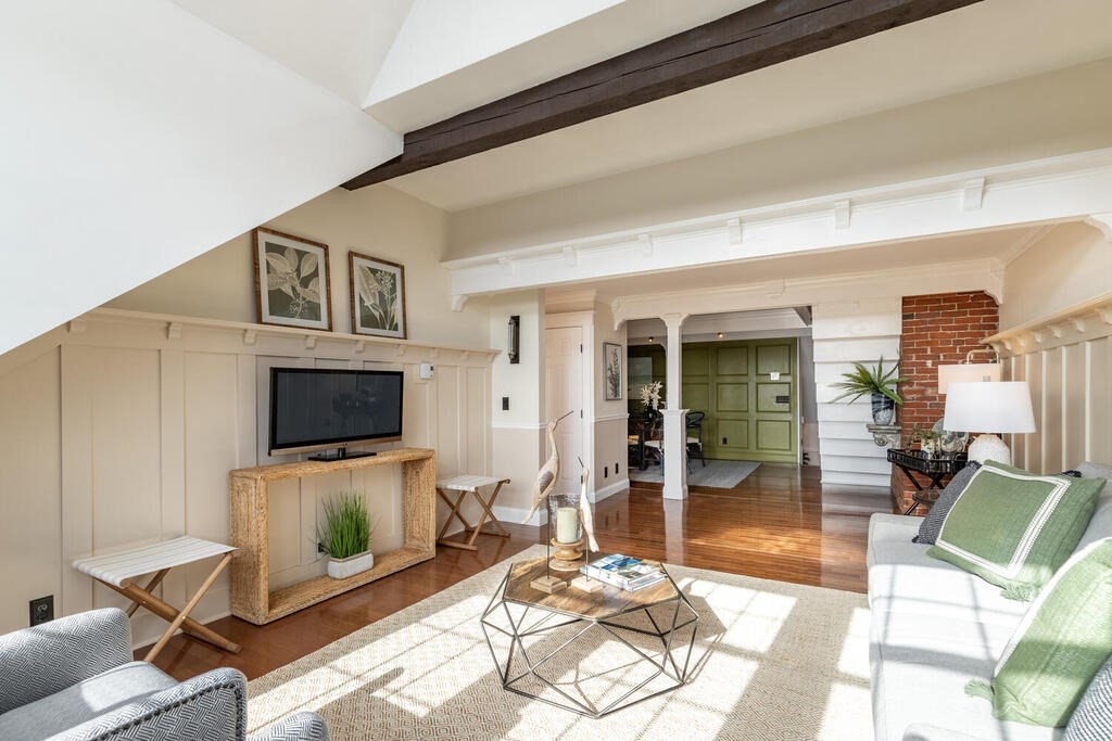 8 Summer Street, Unit 415 Gloucester, MA 01930 - Photo 21 of 32 a living room with furniture and a flat screen tv
