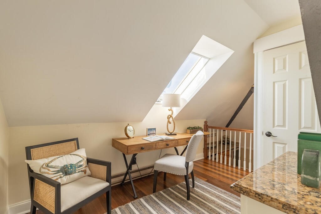 8 Summer Street, Unit 415 Gloucester, MA 01930 - Photo 22 of 32 a living room with furniture and a wooden floor