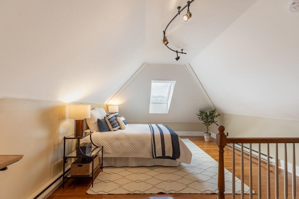 8 Summer Street, Unit 415 Gloucester, MA 01930 - Photo 28 of 32 a bedroom with a bed and window