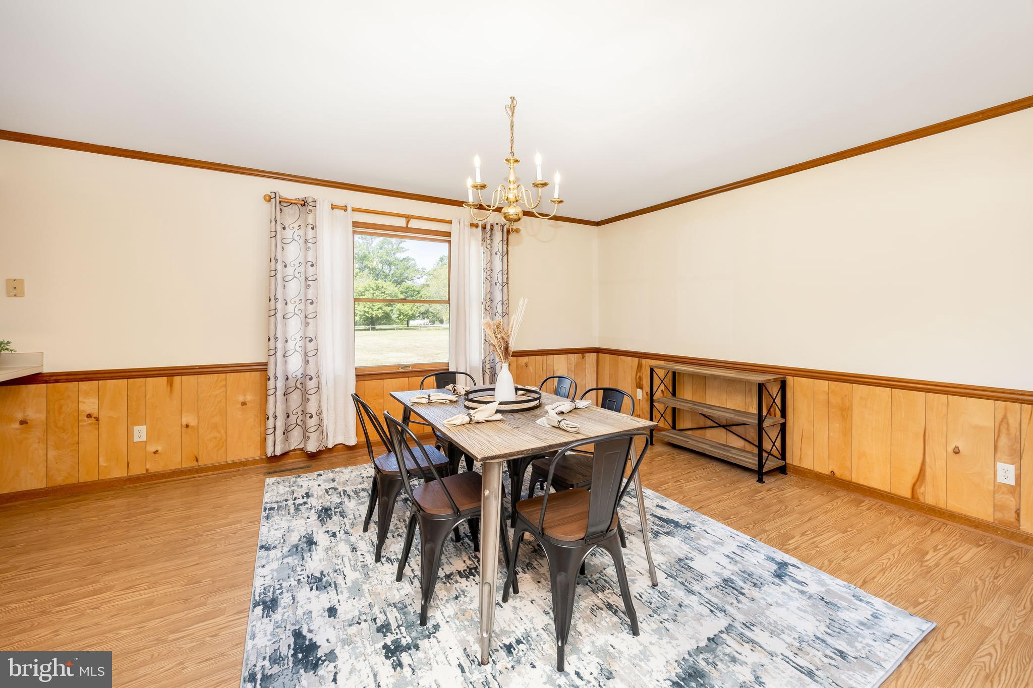 9830 Sharptown Road Mardela Springs, MD 21837 - Photo 12 of 51 a view of a dining room with furniture window and wooden floor