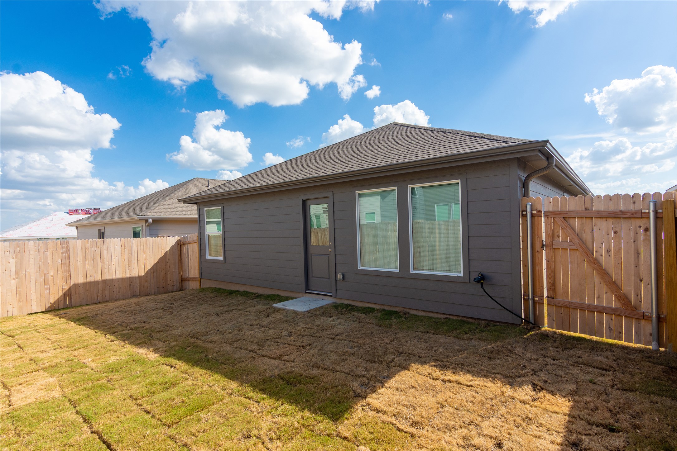 149 Star Packer Lane Jarrell, TX 76537 - Photo 25 of 30 A newly installed sod lawn awaits enjoyment within a fully fenced private yard.