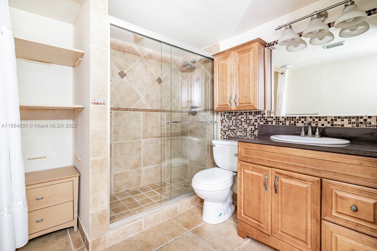 2801 Northeast 183rd Street, Unit 1401W Aventura, FL 33160 - Photo 6 of 26 a bathroom with a sink a toilet and shower