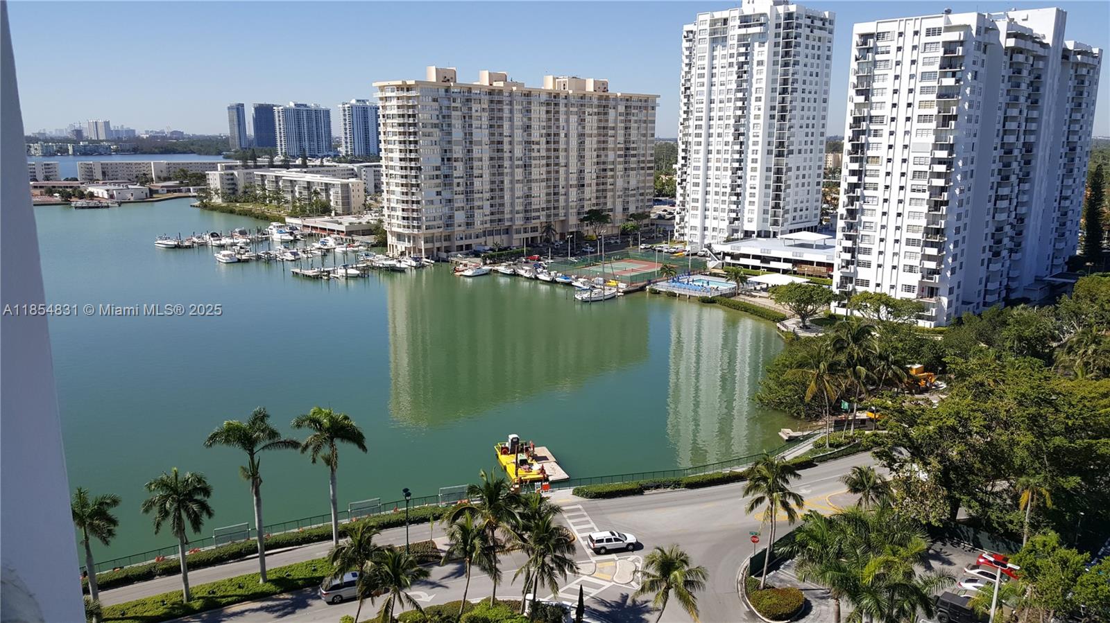 2801 Northeast 183rd Street, Unit 1401W Aventura, FL 33160 - Photo 8 of 26 a view of a lake with tall buildings