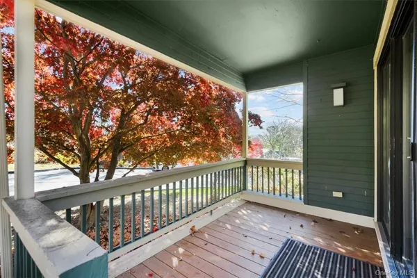 a view of a balcony with wooden floor