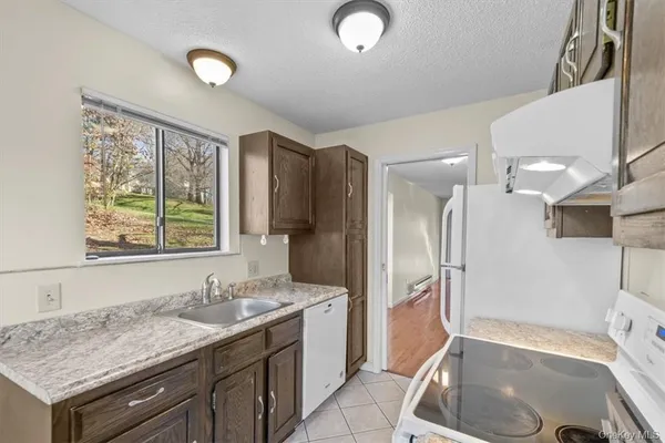 a bathroom with a sink a vanity and a large mirror