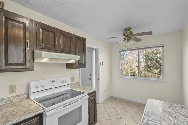 a view of kitchen with furniture and window