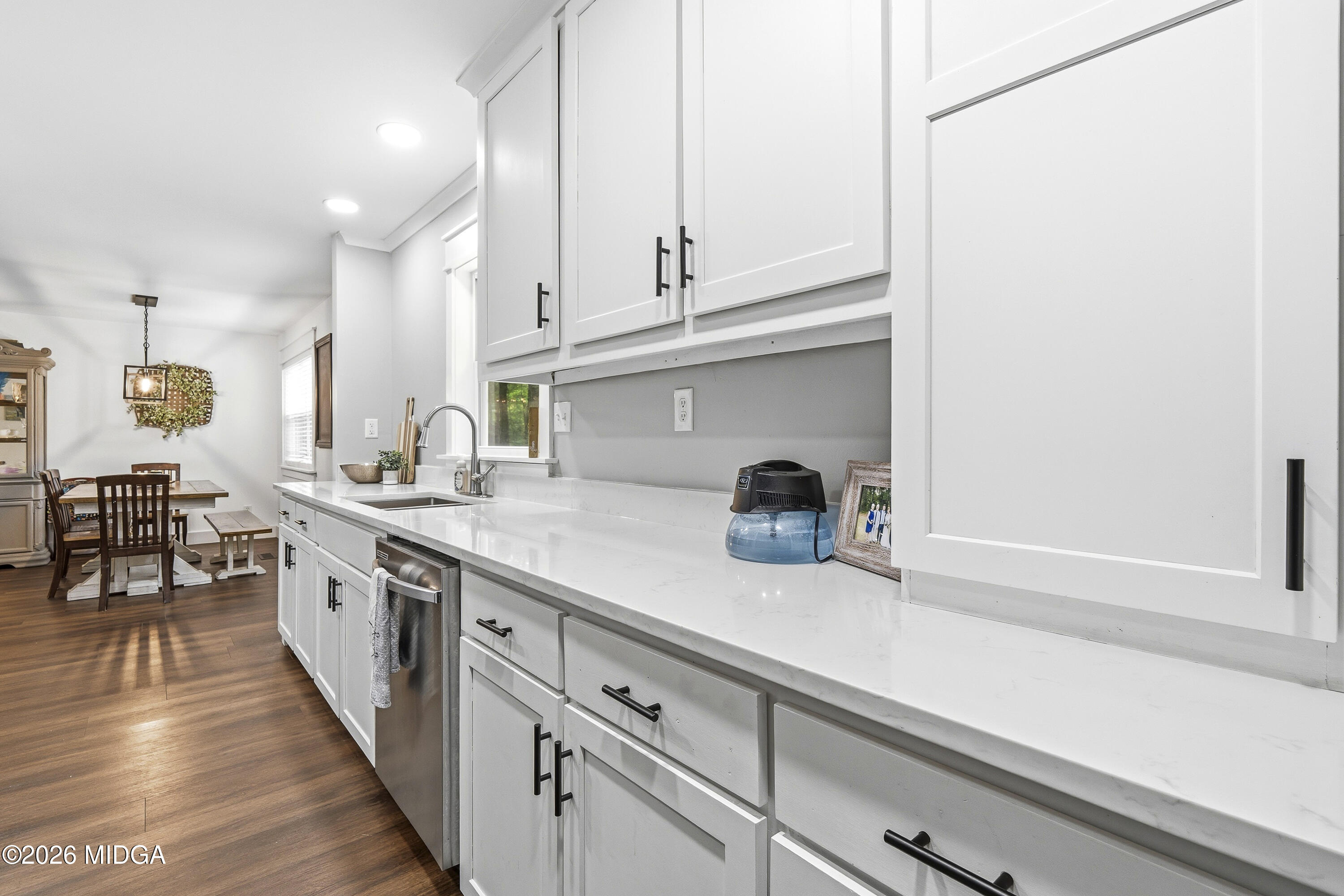 174 Sandra Drive Gray, GA 31032 - Photo 19 of 41 a kitchen with granite countertop white cabinets and white appliances