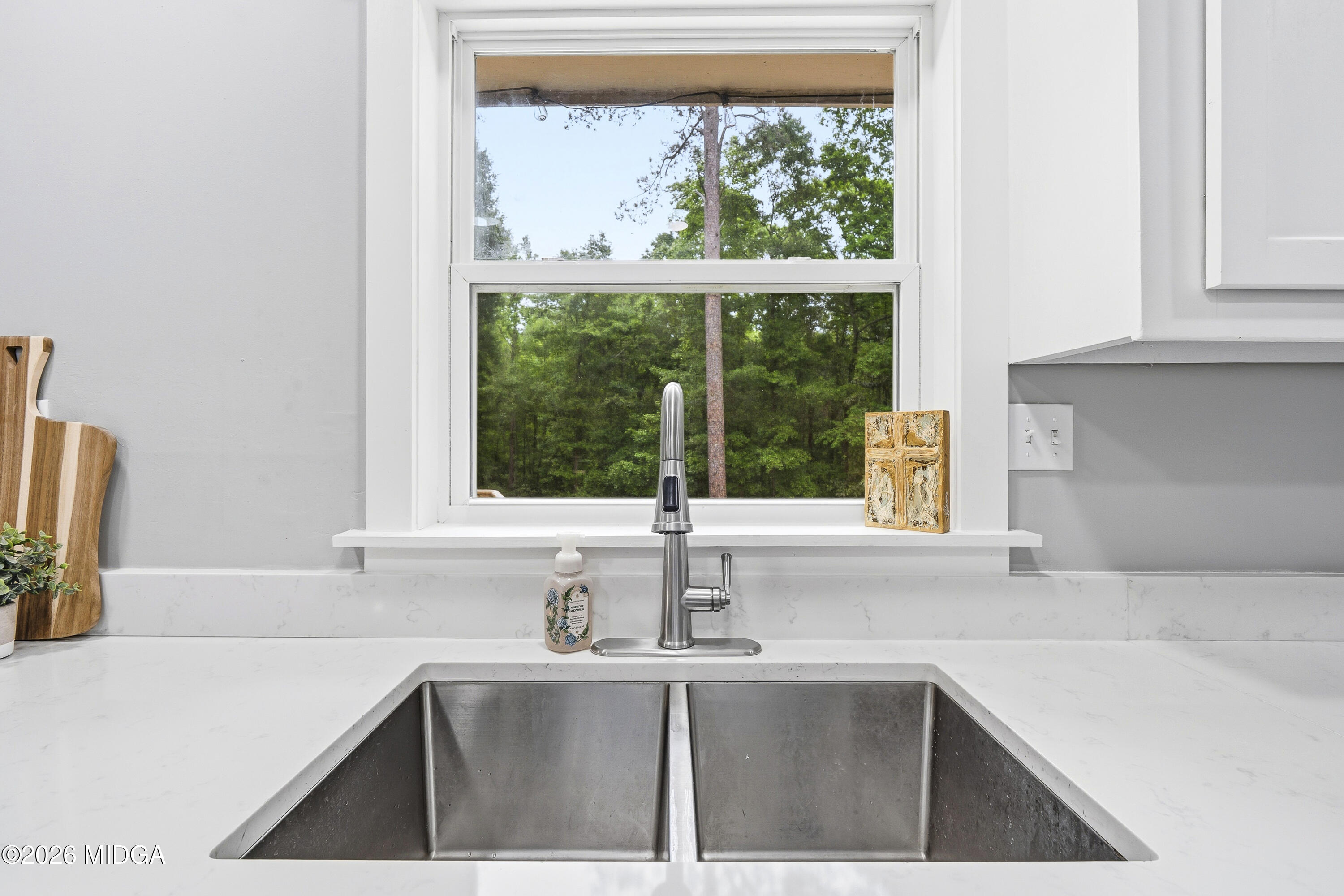 174 Sandra Drive Gray, GA 31032 - Photo 20 of 41 a kitchen with a sink and large window