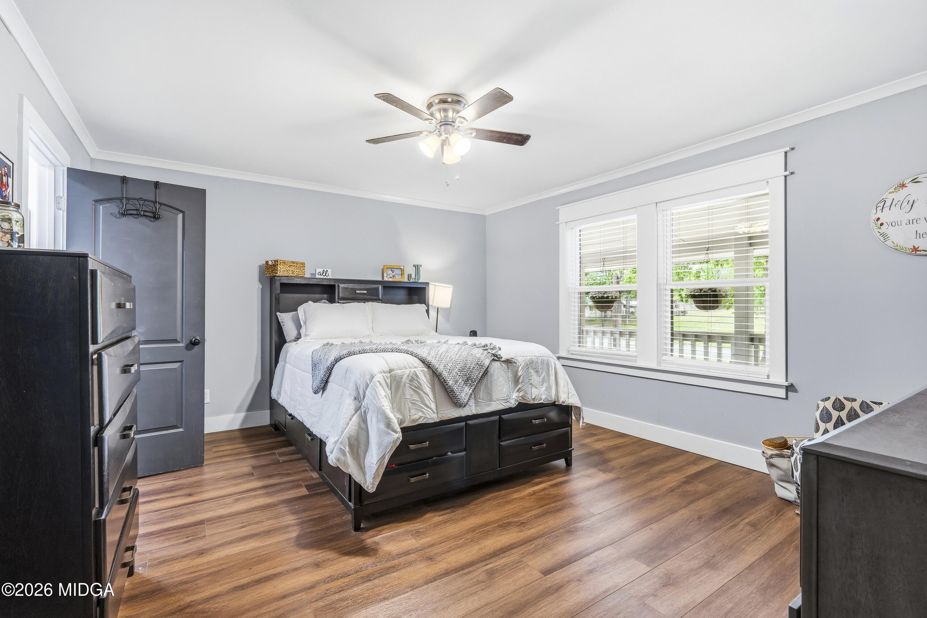 174 Sandra Drive Gray, GA 31032 - Photo 21 of 41 a bed sitting in a bedroom next to a window