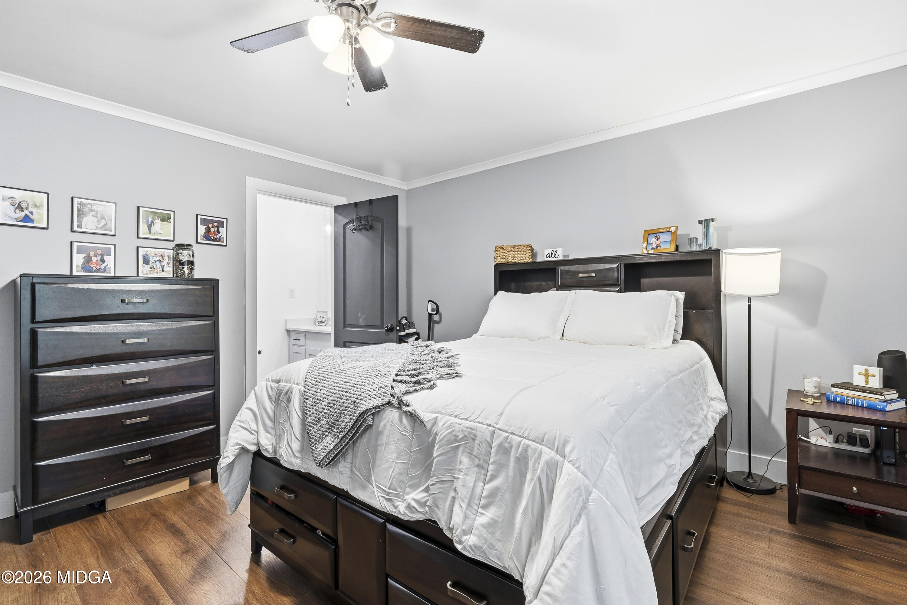 174 Sandra Drive Gray, GA 31032 - Photo 22 of 41 a bedroom with a bed and a chandelier