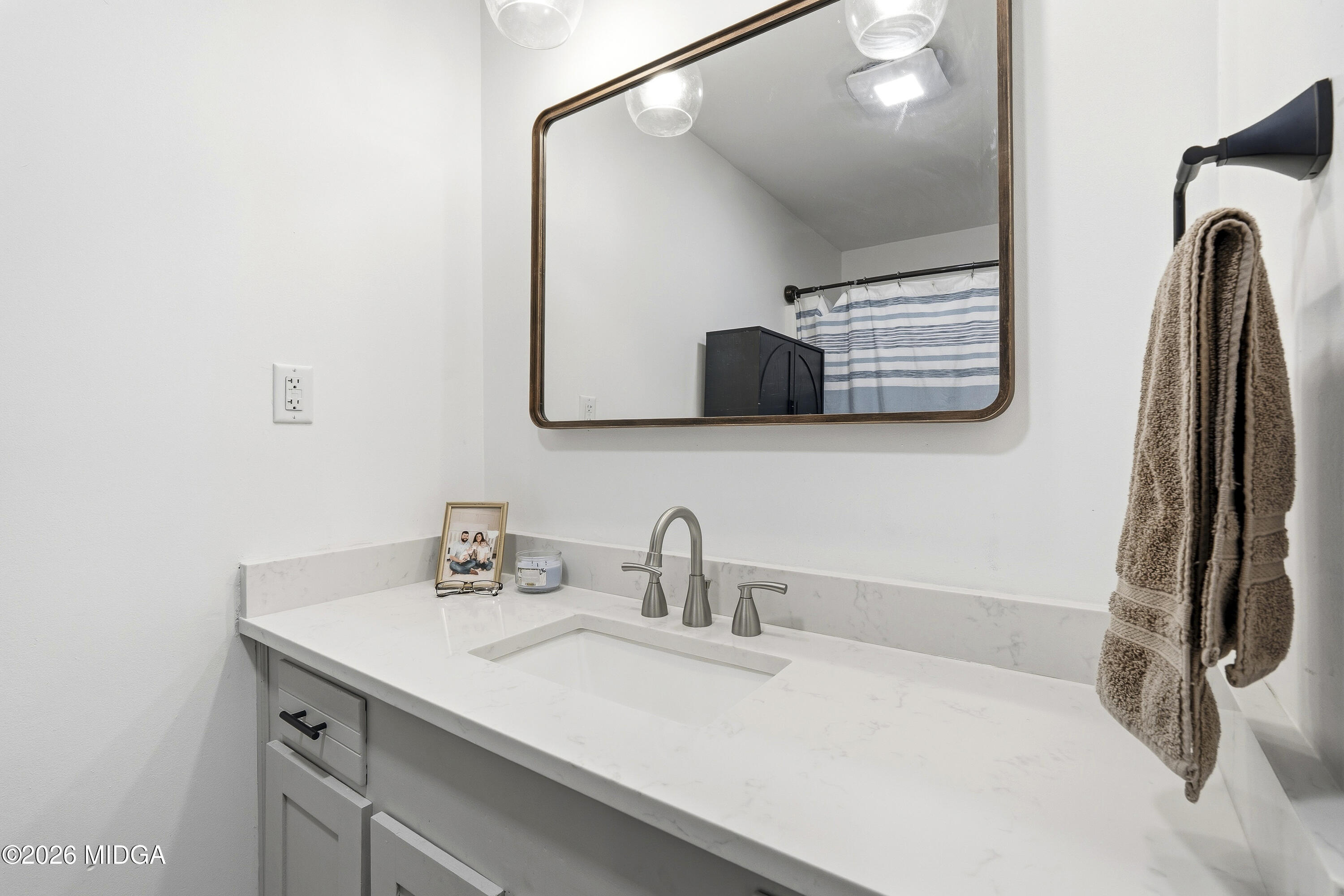 174 Sandra Drive Gray, GA 31032 - Photo 23 of 41 a bathroom with a sink and a mirror
