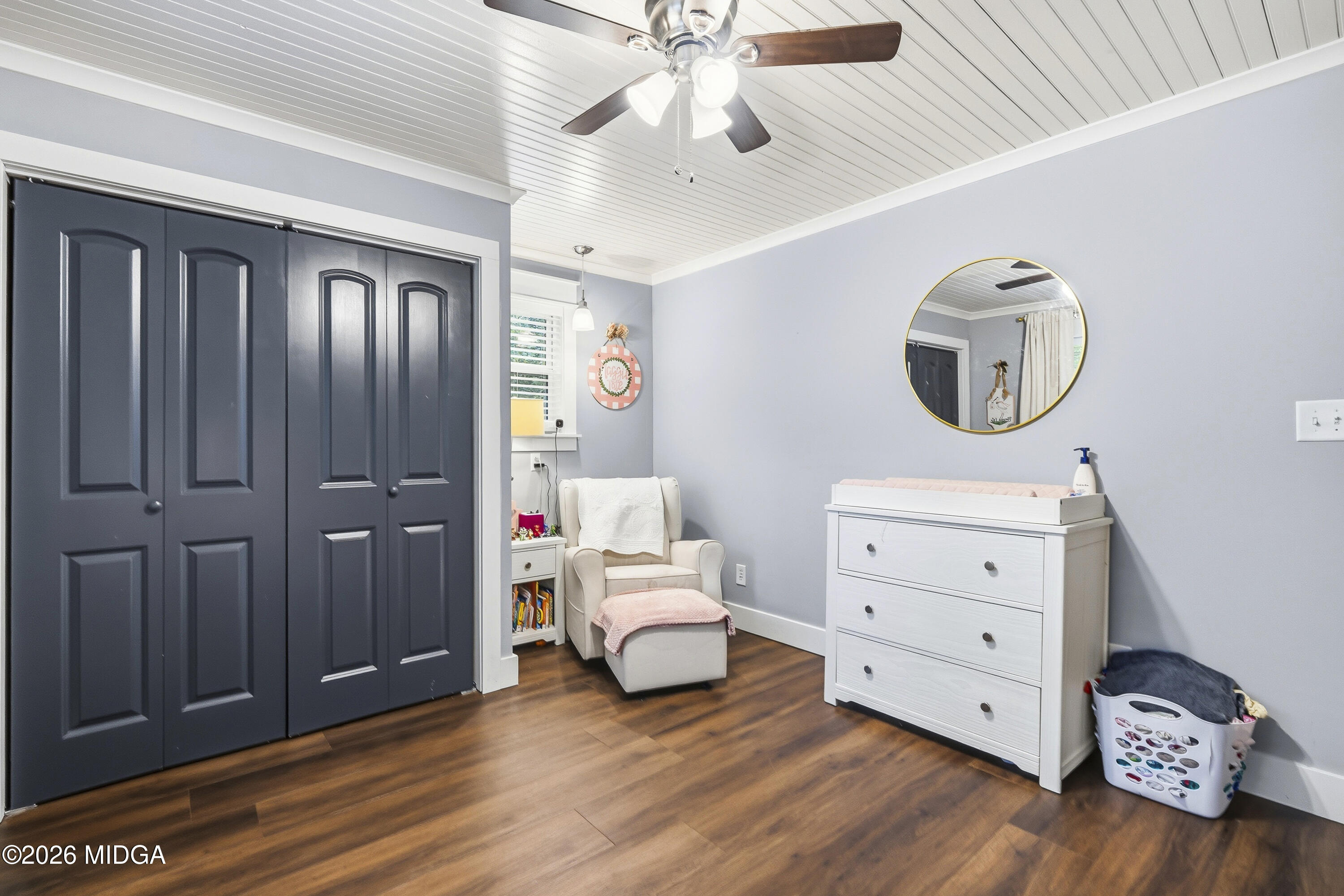 174 Sandra Drive Gray, GA 31032 - Photo 26 of 41 a bedroom with a bed and a chandelier