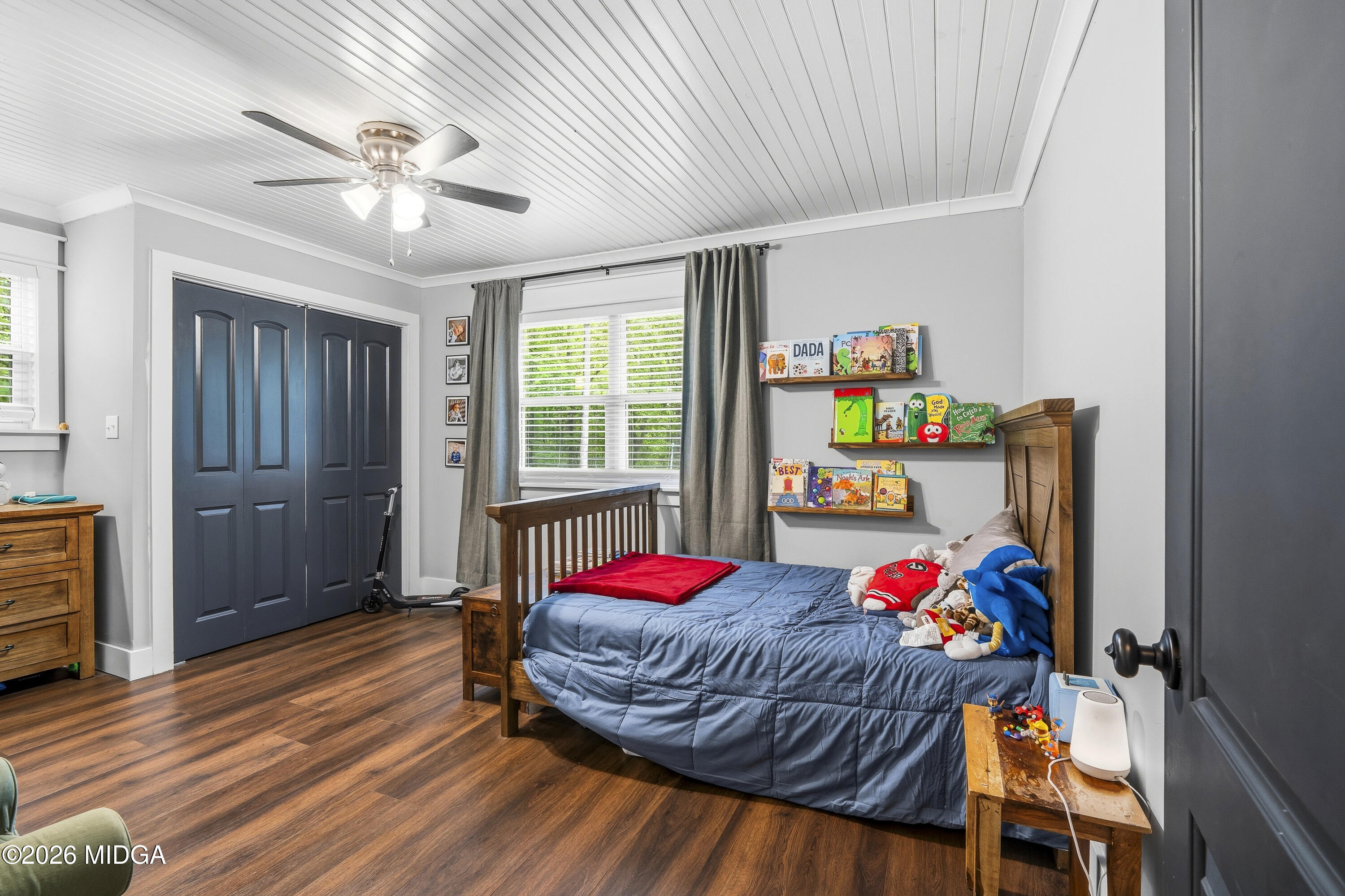 174 Sandra Drive Gray, GA 31032 - Photo 28 of 41 a bedroom with a bed and a chandelier