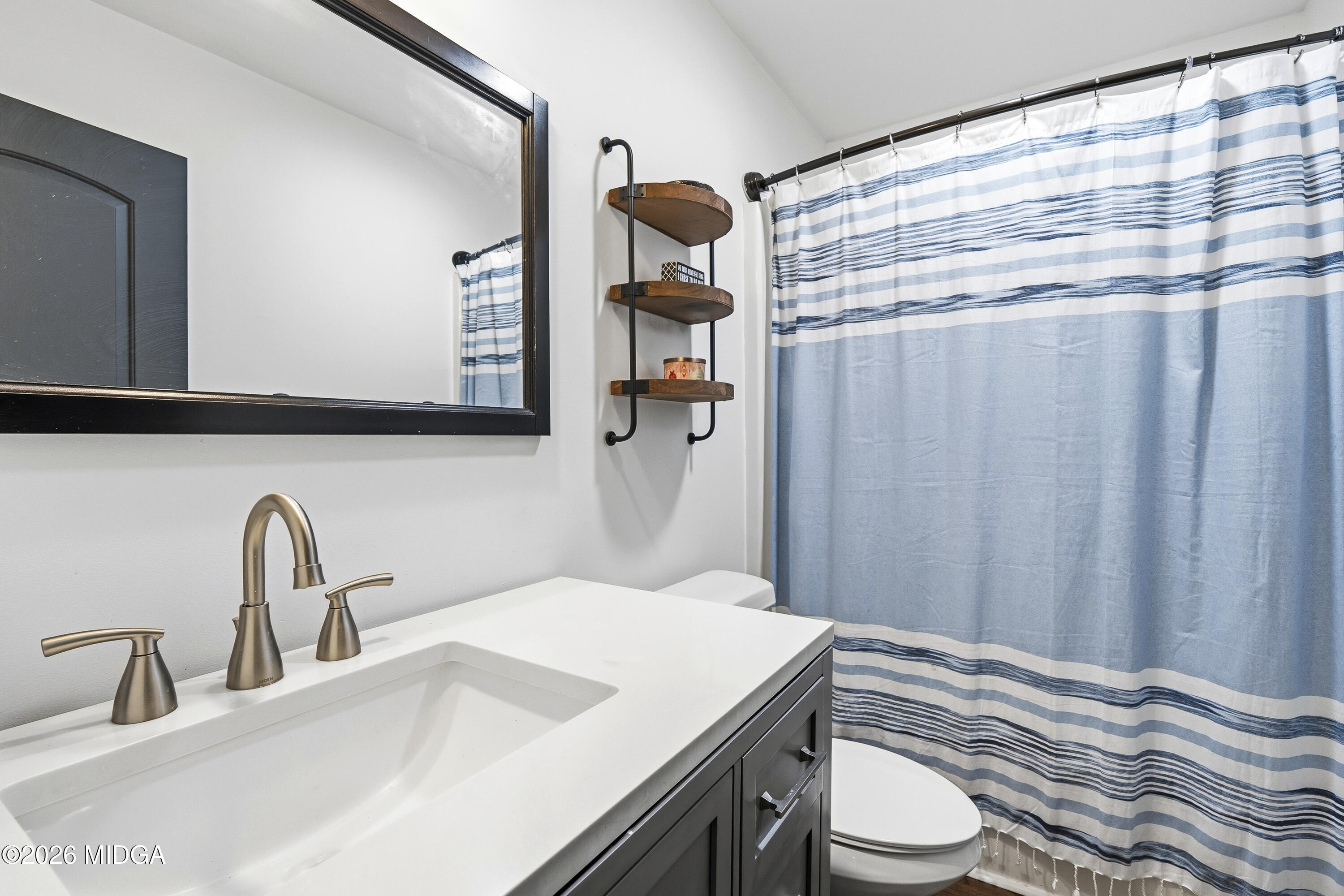 174 Sandra Drive Gray, GA 31032 - Photo 31 of 41 a bathroom with a sink and a mirror