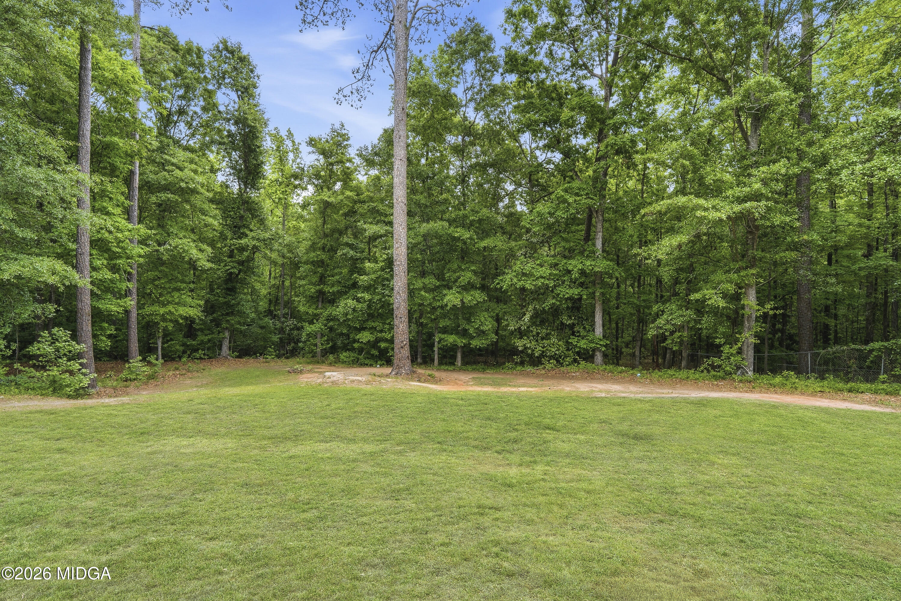 174 Sandra Drive Gray, GA 31032 - Photo 36 of 41 a backyard of a house with lots of green space and fountain