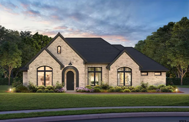 a view of a big house with garden