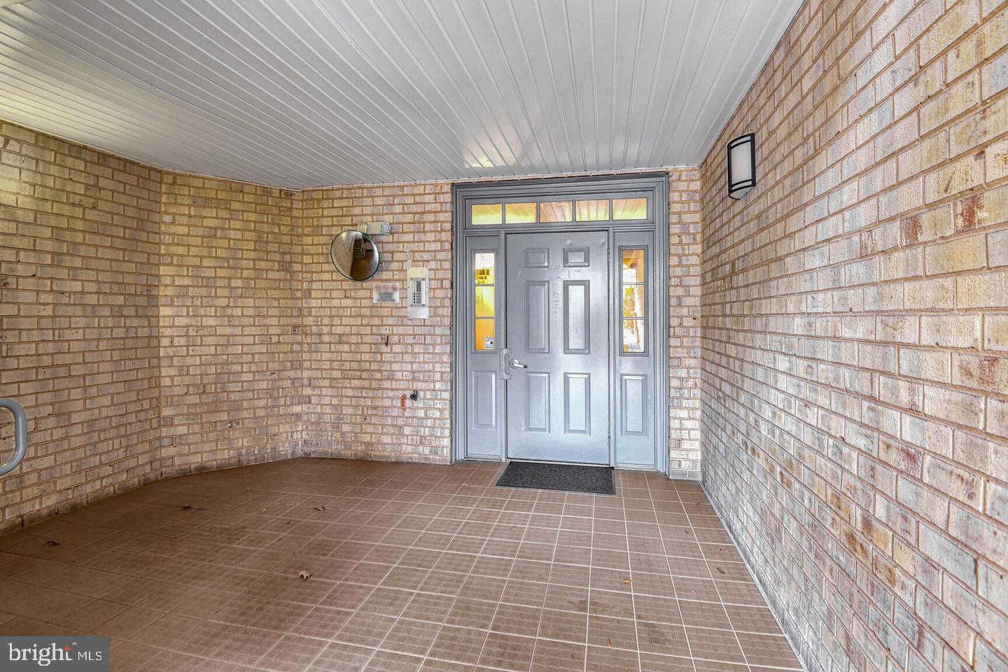 13701 Modrad Way, Unit 9C12 Silver Spring, MD 20904 - Photo 11 of 12 a view of a brick house with an empty space