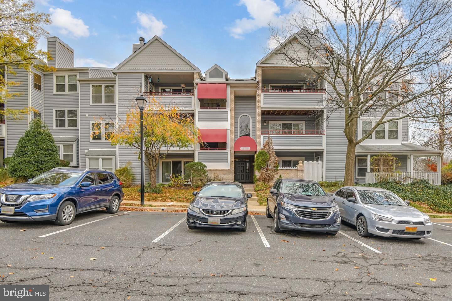 13701 Modrad Way, Unit 9C12 Silver Spring, MD 20904 - Photo 10 of 12 a car parked in front of a house