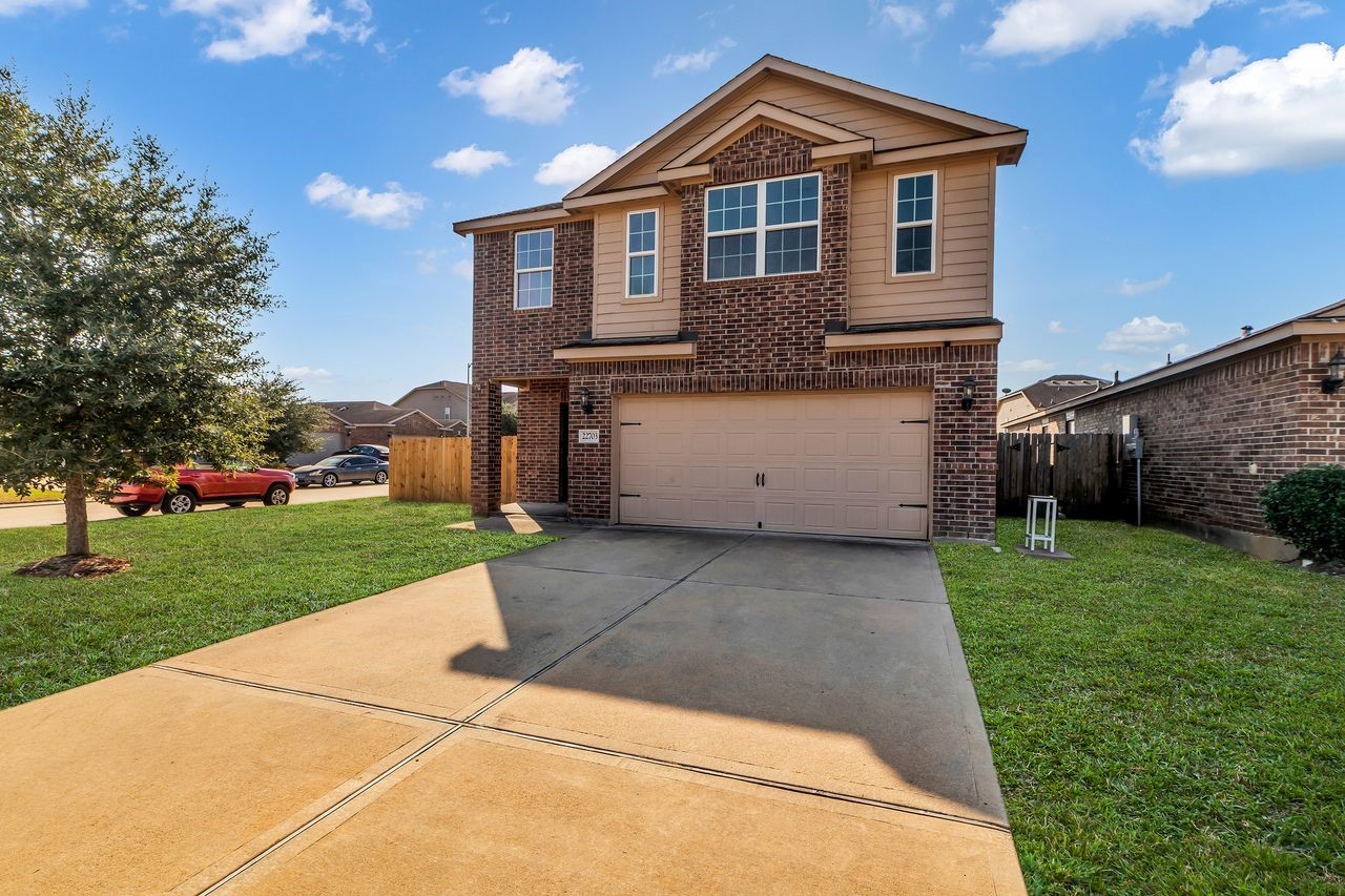 22703 Threefold Ridge Drive Hockley, TX 77447 - Photo 2 of 36 a front view of a house with a yard