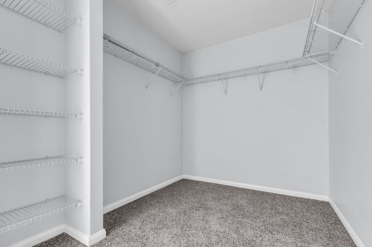 22703 Threefold Ridge Drive Hockley, TX 77447 - Photo 26 of 36 a view of an empty walk in closet