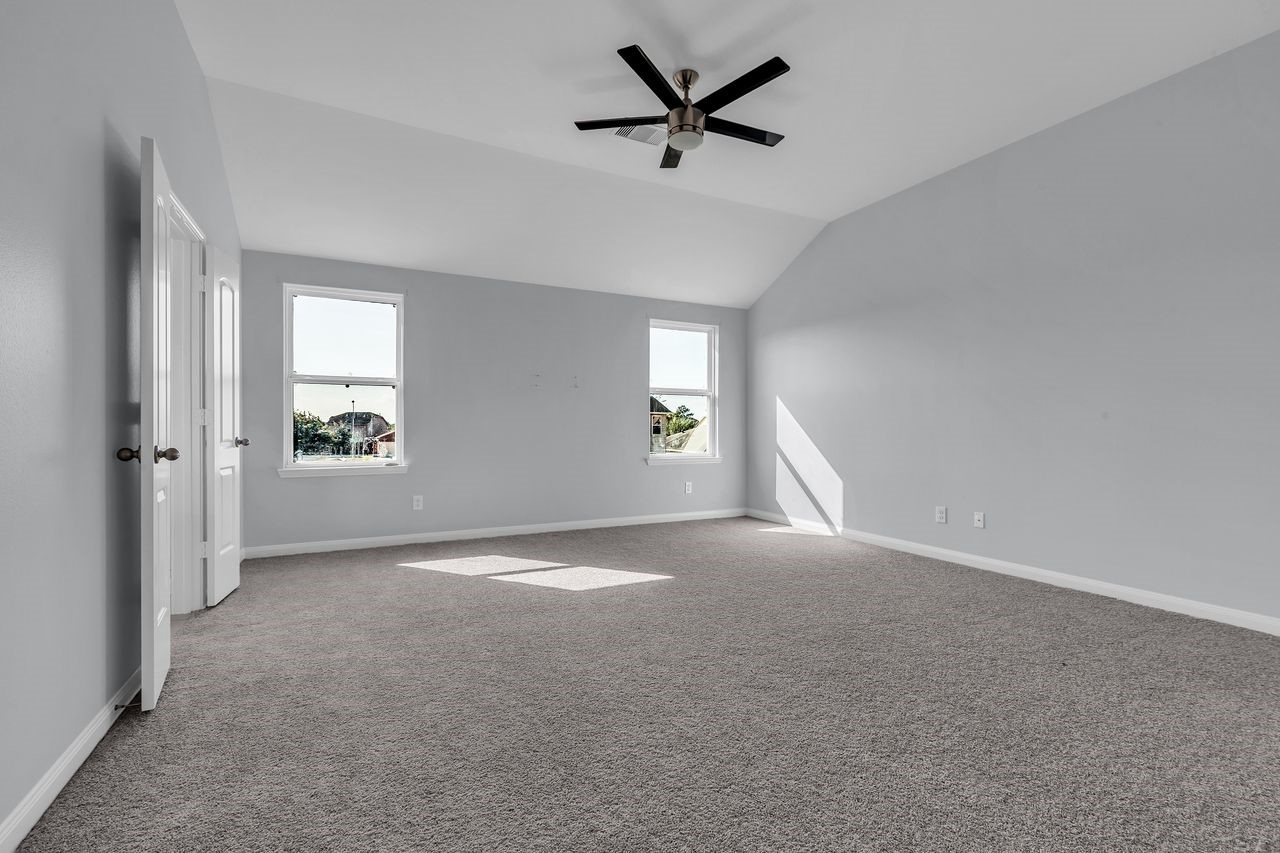 22703 Threefold Ridge Drive Hockley, TX 77447 - Photo 27 of 36 a view of a livingroom with a ceiling fan and window