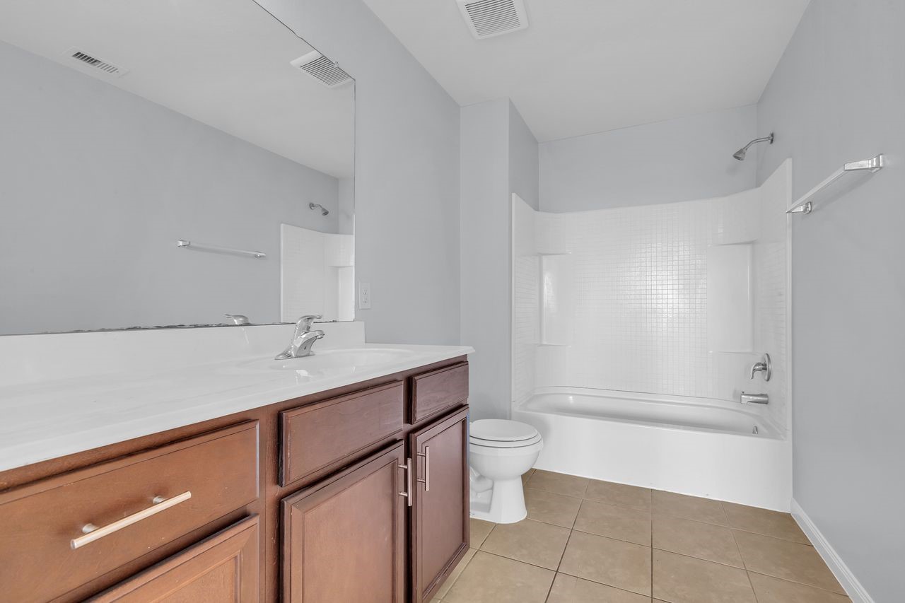 22703 Threefold Ridge Drive Hockley, TX 77447 - Photo 34 of 36 a bathroom with a sink a toilet and shower