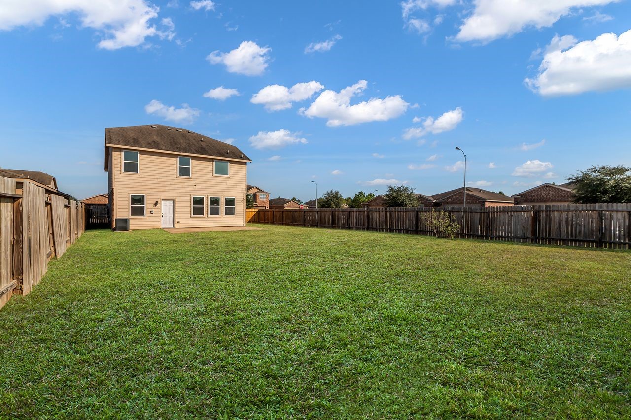 22703 Threefold Ridge Drive Hockley, TX 77447 - Photo 36 of 36 a house view with a big yard