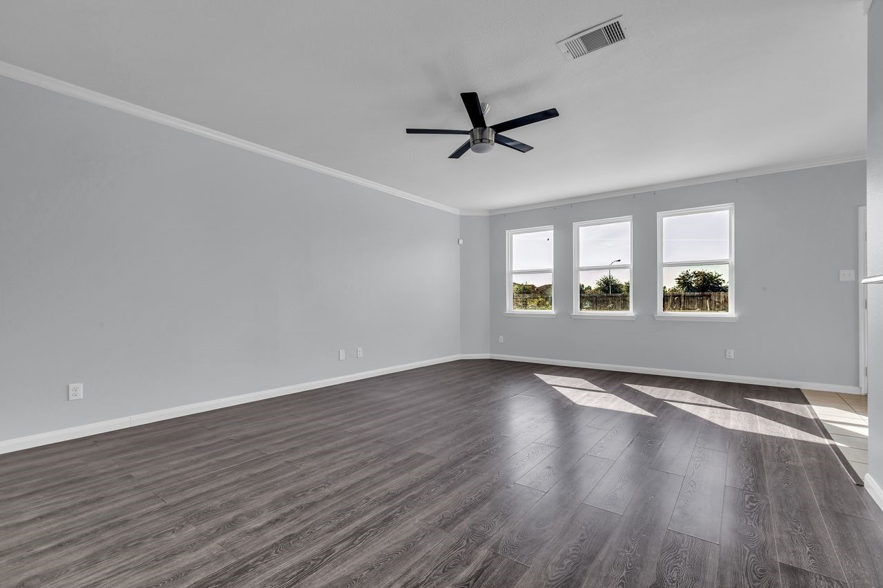 22703 Threefold Ridge Drive Hockley, TX 77447 - Photo 8 of 36 a view of empty room with wooden floor and fan