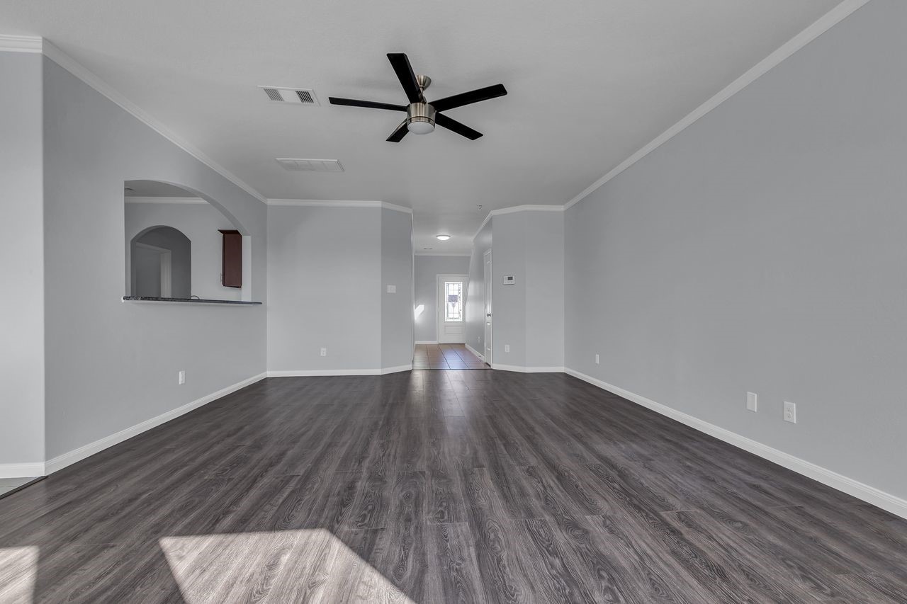 22703 Threefold Ridge Drive Hockley, TX 77447 - Photo 10 of 36 a view of empty room with wooden floor and fan